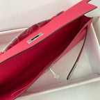 KELLY CUT 31 IN CHERRY RED CALFSKIN WITH SILVER HARDWARE