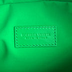 INTRECCIATO CLUTCH 26 IN MALACHITE GREEN CALFSKIN