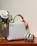 KELLY SELLIER 25 BAG IN PALE GRAY OSTRICH LEATHER WITH SILVER HARDWARE (MADE-TO-ODER)