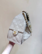 CC 25 HANDBAG IN CREAM 30 GRAINED CALFSKIN GOLD HARDWARE